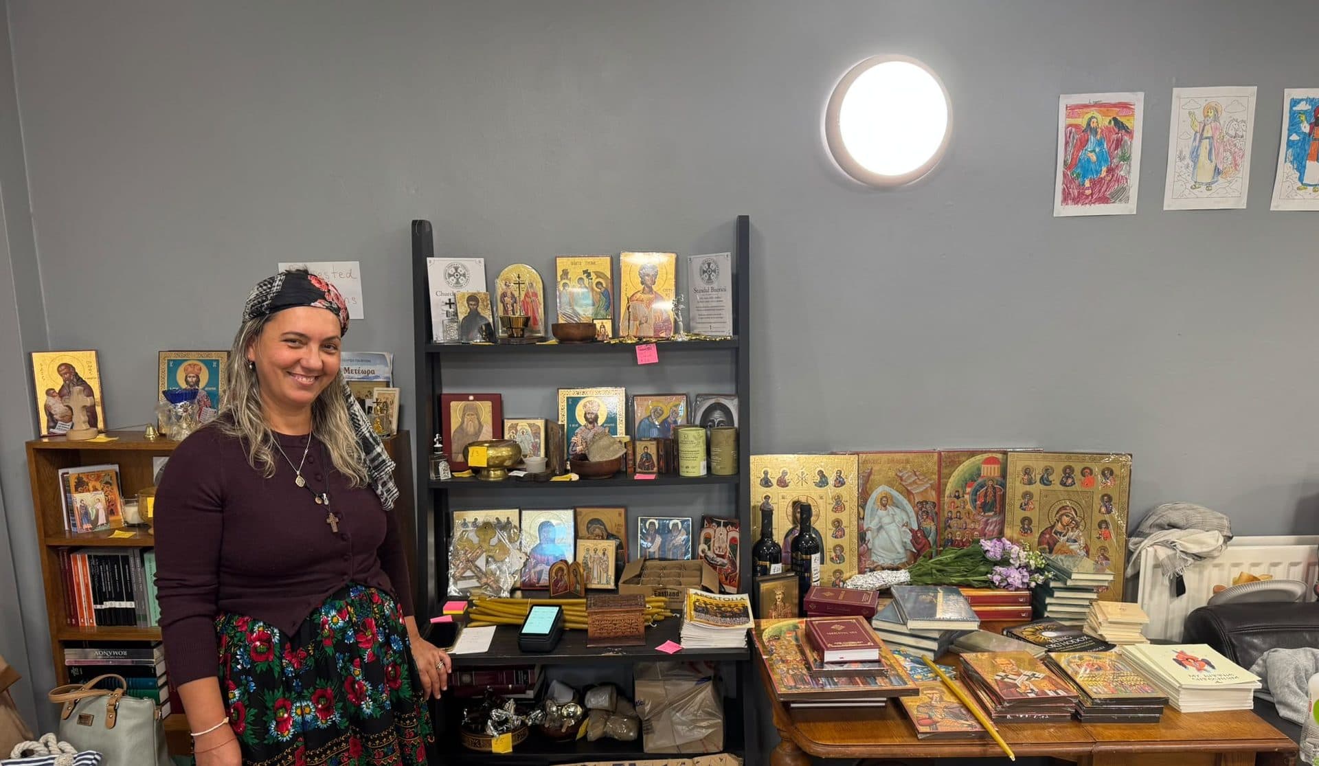 Ionelia, who keeps the Church Stall, beside its shelves of icons, books and candles in St Nics Youth Centre