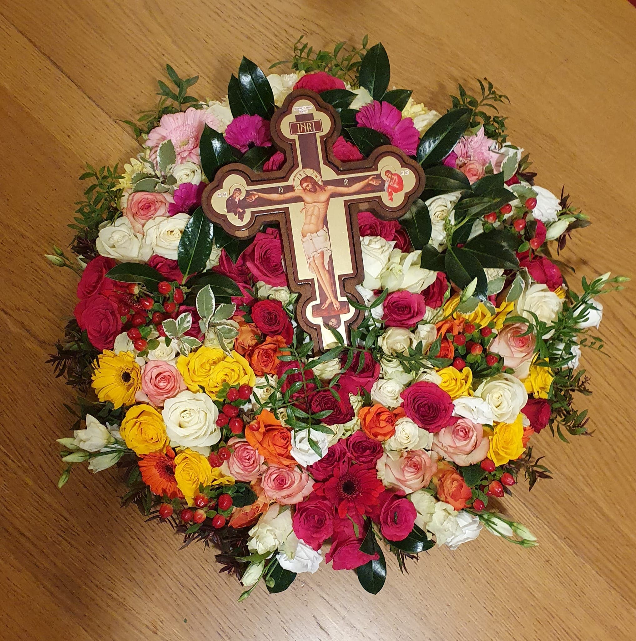 Flowers adorning the Holy Cross