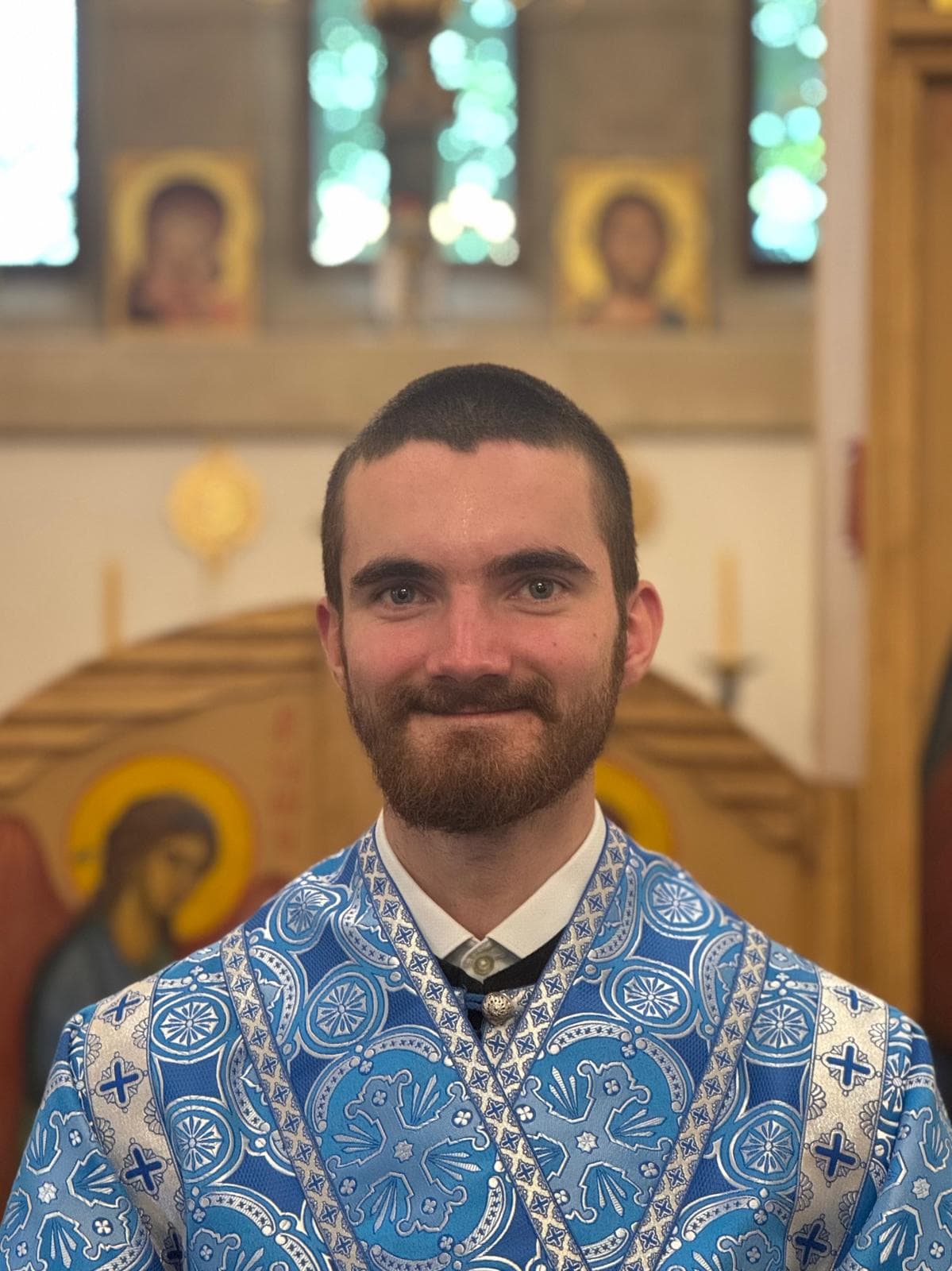 Subdeacon Daniel Portwine, vested in blue and silver, before the iconostasis