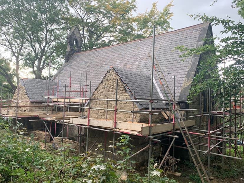The church under scaffolding with the rear extension rising